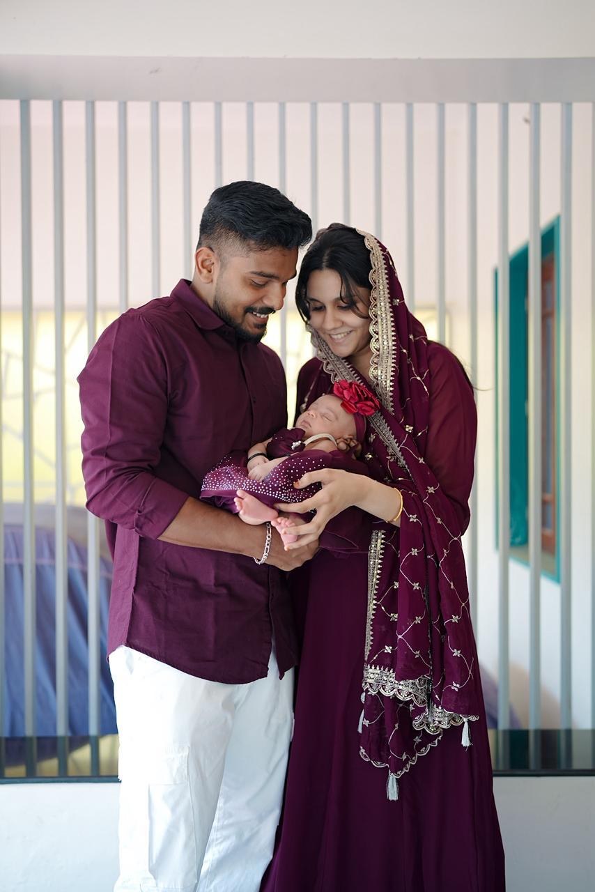Ameera with her husband and their baby